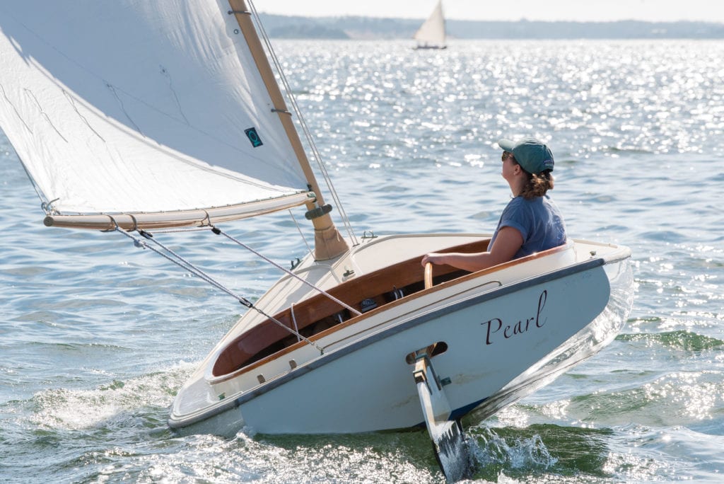 The shallow draft of the 14-foot Catboat allows it to sail with ease... 